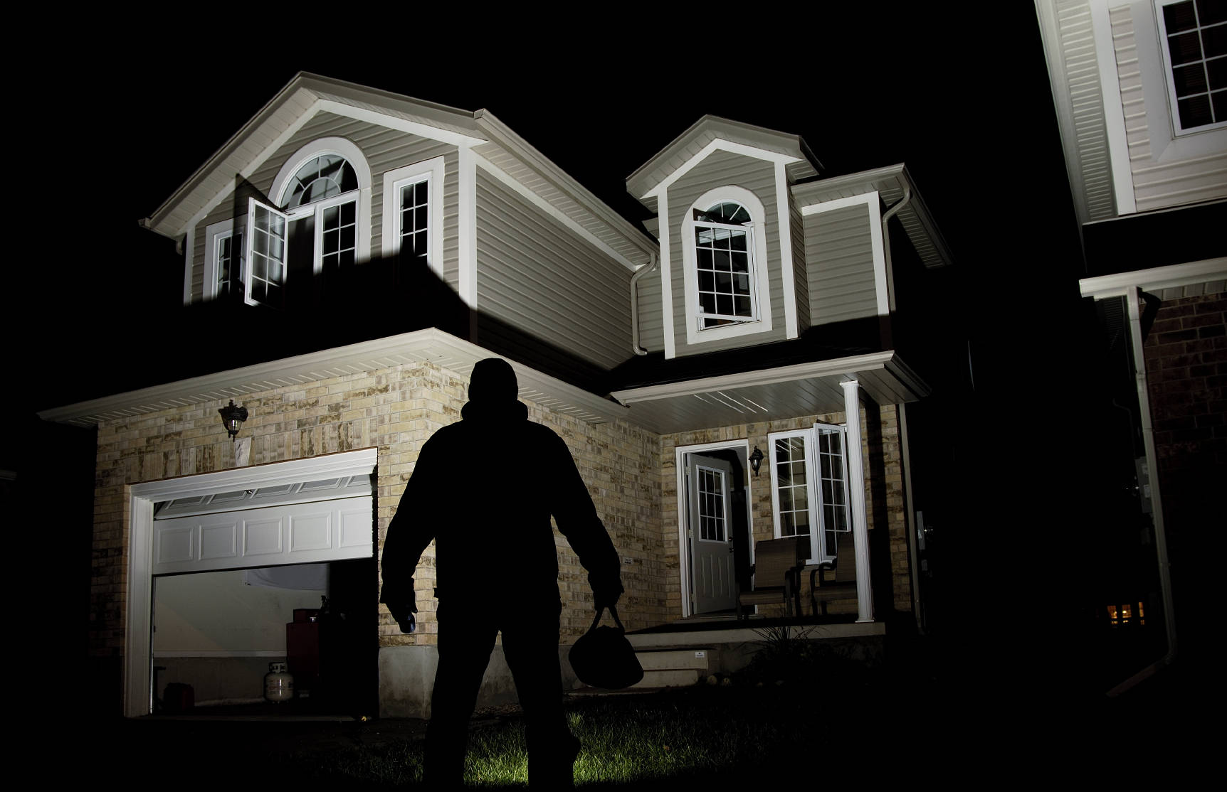 Shadow of a man staring into the big house